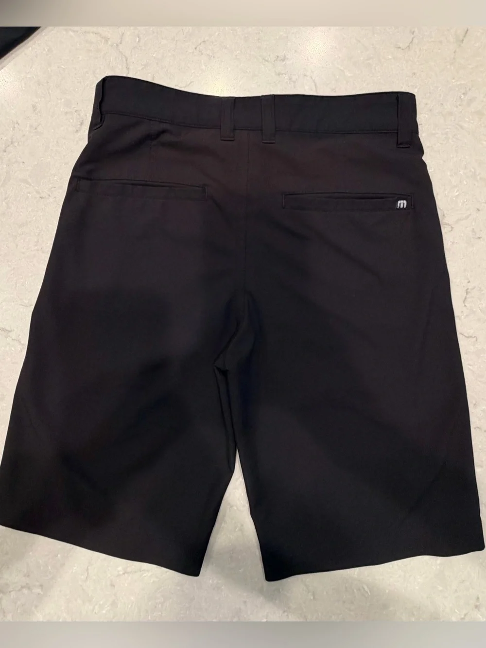 Travis Mathew Black Wanderlust junior golf shorts